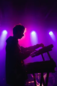 man playing synthesizer